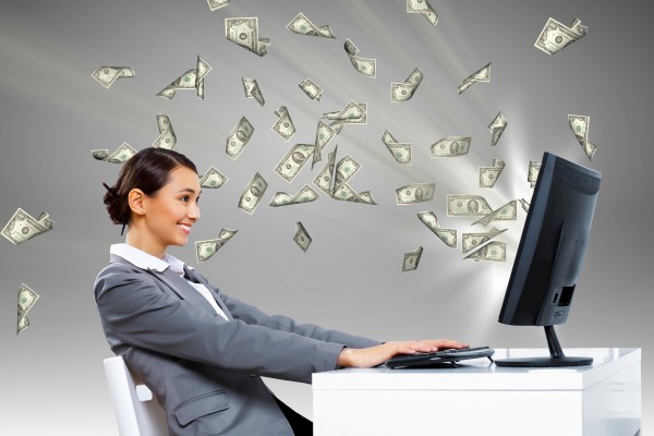 Businesswoman-at-workplace-and-money-e1443005316576