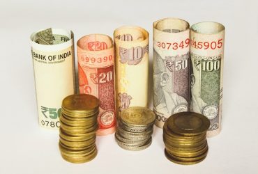 Indian rupee notes and coins of different denomination.